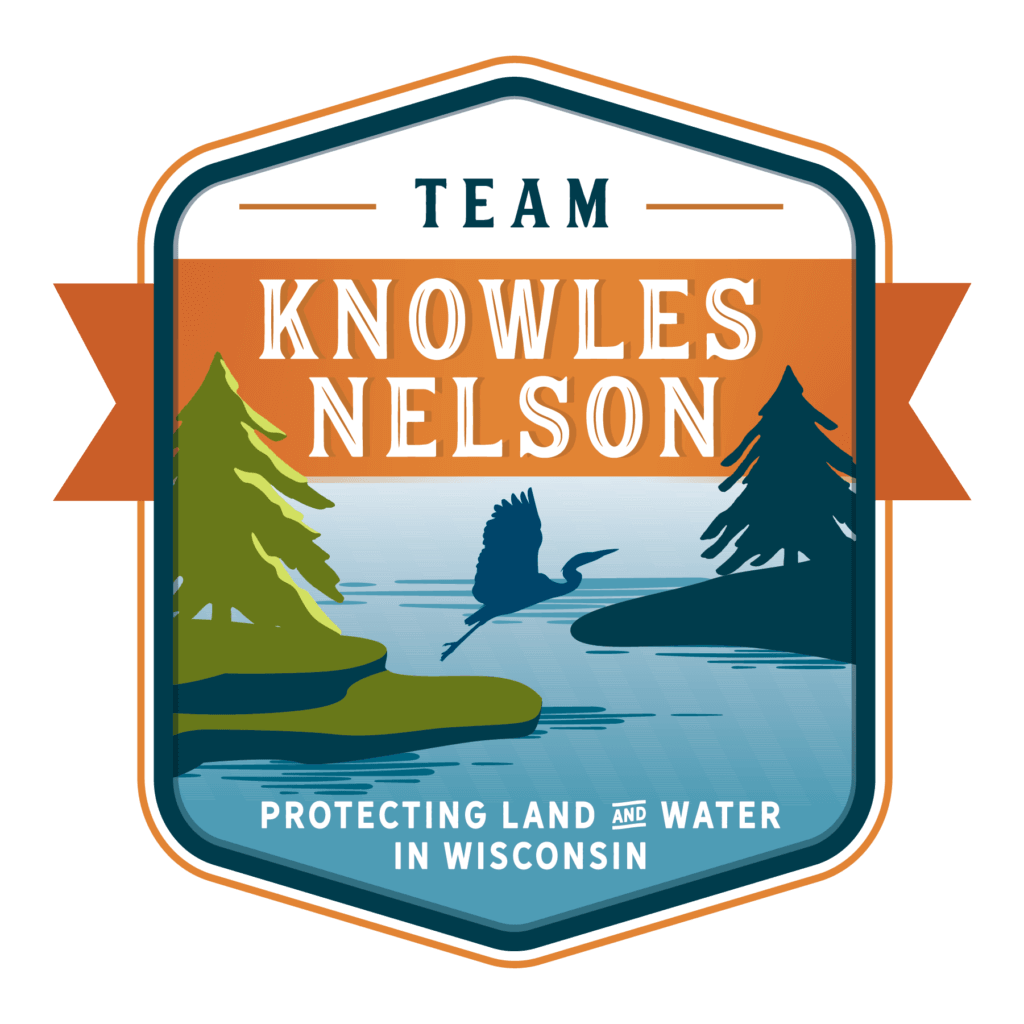 Team Knowles Nelson badge with a bird taking flight.