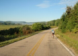 Biking along the road in Dane County, where a bike/pedestrian trail will be expanded thanks to Knowles-Nelson.