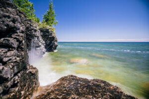 Wave hitting the rock in Door County, where the Knowles-Nelson Stewardship has had a huge impact on conserved lands.
