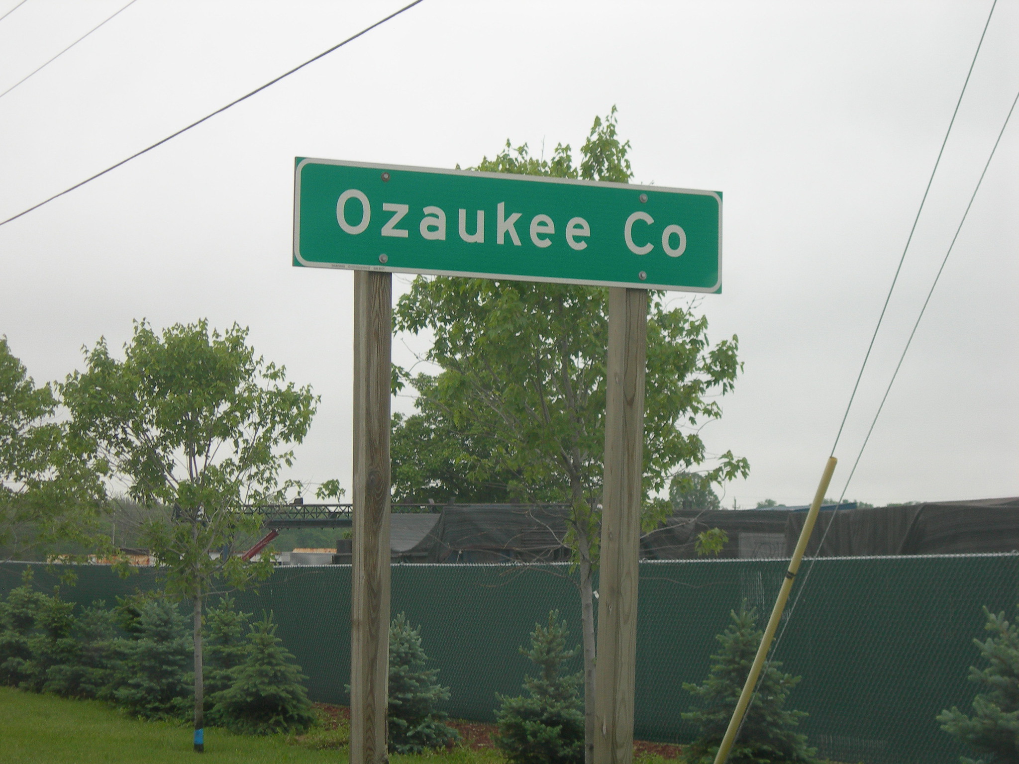 Green road sign for Ozaukee Co.